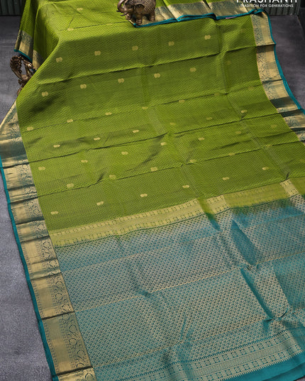 Pure kanjivaram silk saree mehendi green and peacock green with allover self emboss & zari buttas and floral zari woven border