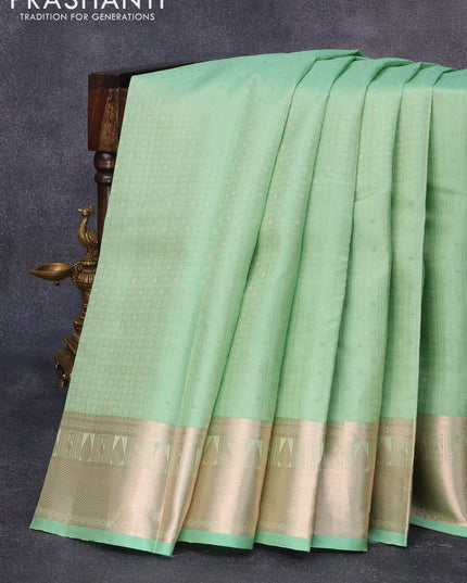 Pure kanjivaram silk saree pastel green and pink with allover self emboss & zari buttas and copper zari woven border
