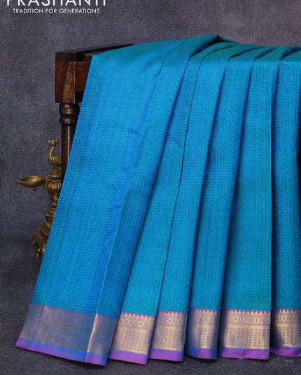 Pure kanjivaram silk saree dual shade of greenish blue and dual shade of bluish pink with allover self emboss and zari woven border