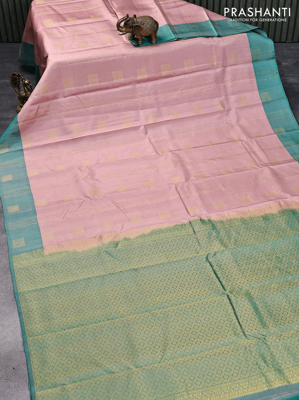 Pure kanjivaram silk saree pastel peach shade and dual shade of green with self emboss & copper zari weaves and zari woven butta border
