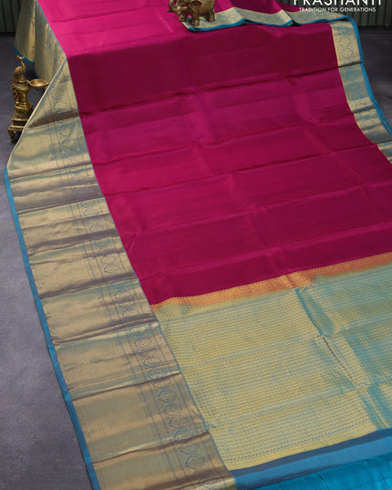 Pure kanjivaram silk saree magenta pink and peacock green with plain body and long zari woven border