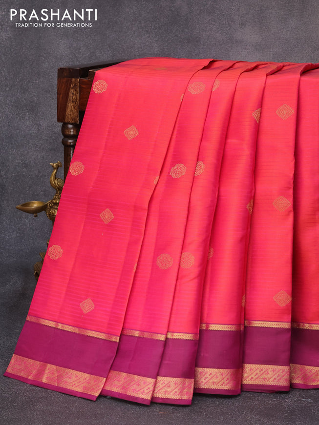 Pure kanjivaram silk saree dual shade of pinkish orange and purple with zari woven buttas and rettapet zari woven border