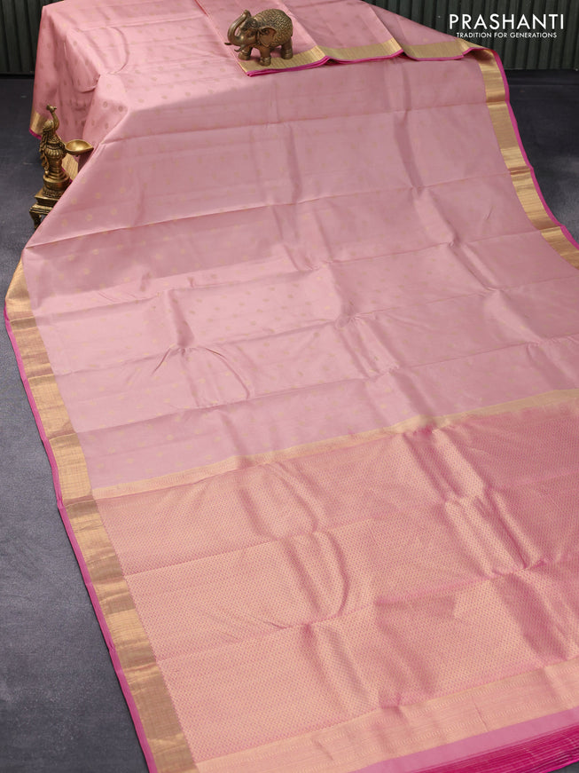 Pure kanjivaram silk saree pastel peach shade and pink with allover zari buttas and zari woven border