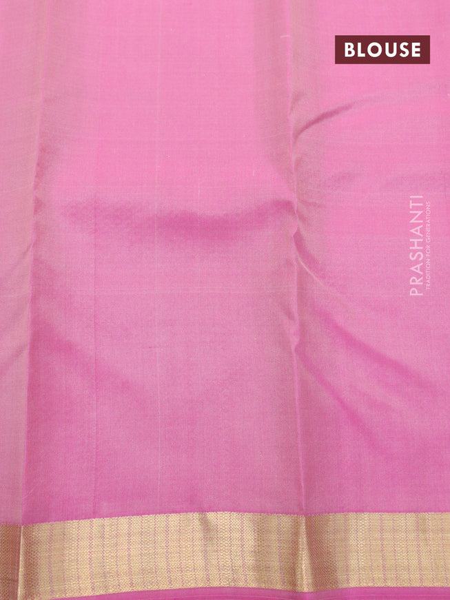 Pure kanjivaram silk saree pastel peach shade and pink with allover zari buttas and zari woven border