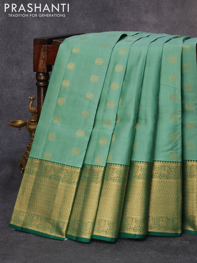 Pure kanjivaram silk saree teal green shade and green with zari woven buttas and long rich zari woven border