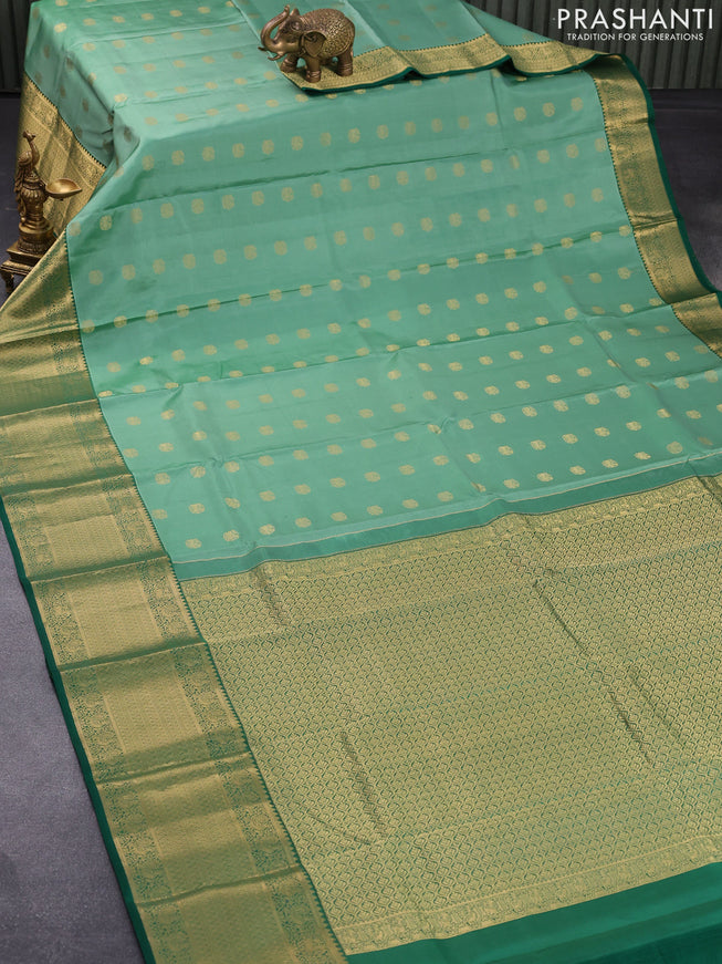Pure kanjivaram silk saree teal green shade and green with zari woven buttas and long rich zari woven border
