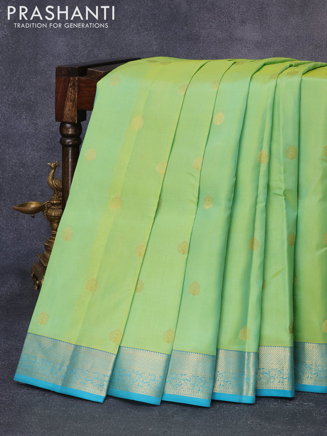 Pure kanjivaram silk saree dual shade of lime green and teal blue with zari woven buttas and zari woven border
