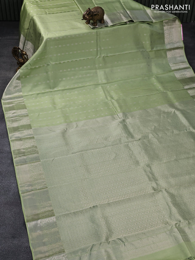 Pure kanjivaram silk saree pista green and dark green with allover silver zari woven buttas and floral silver zari woven border