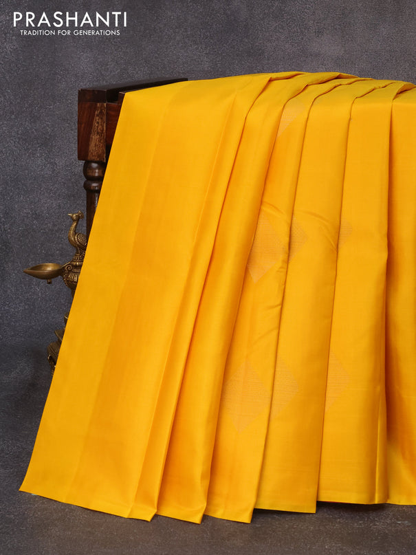 Pure kanjivaram silk saree mango yellow and dark pink with geometric zari woven buttas in borderless style