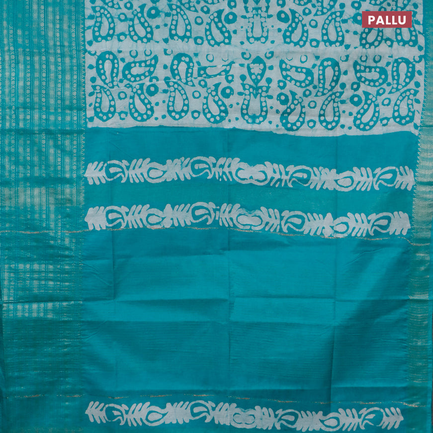 Semi tussar saree teal green with allover batik prints and long zari woven border