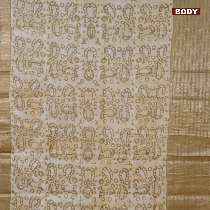 Semi tussar saree elaichi green and beige with allover batik prints and long zari woven border