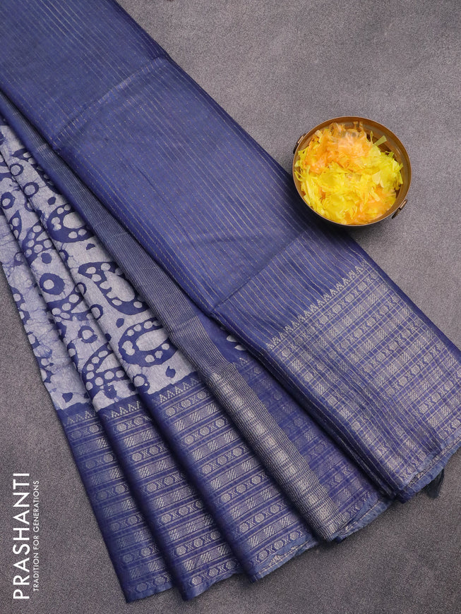 Semi tussar saree blue and off white with allover batik prints and long zari woven border