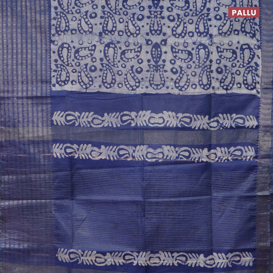 Semi tussar saree blue and off white with allover batik prints and long zari woven border