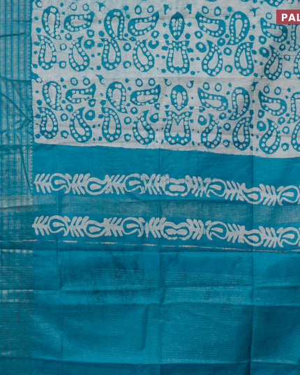 Semi tussar saree teal blue and beige with allover batik prints and long zari woven border