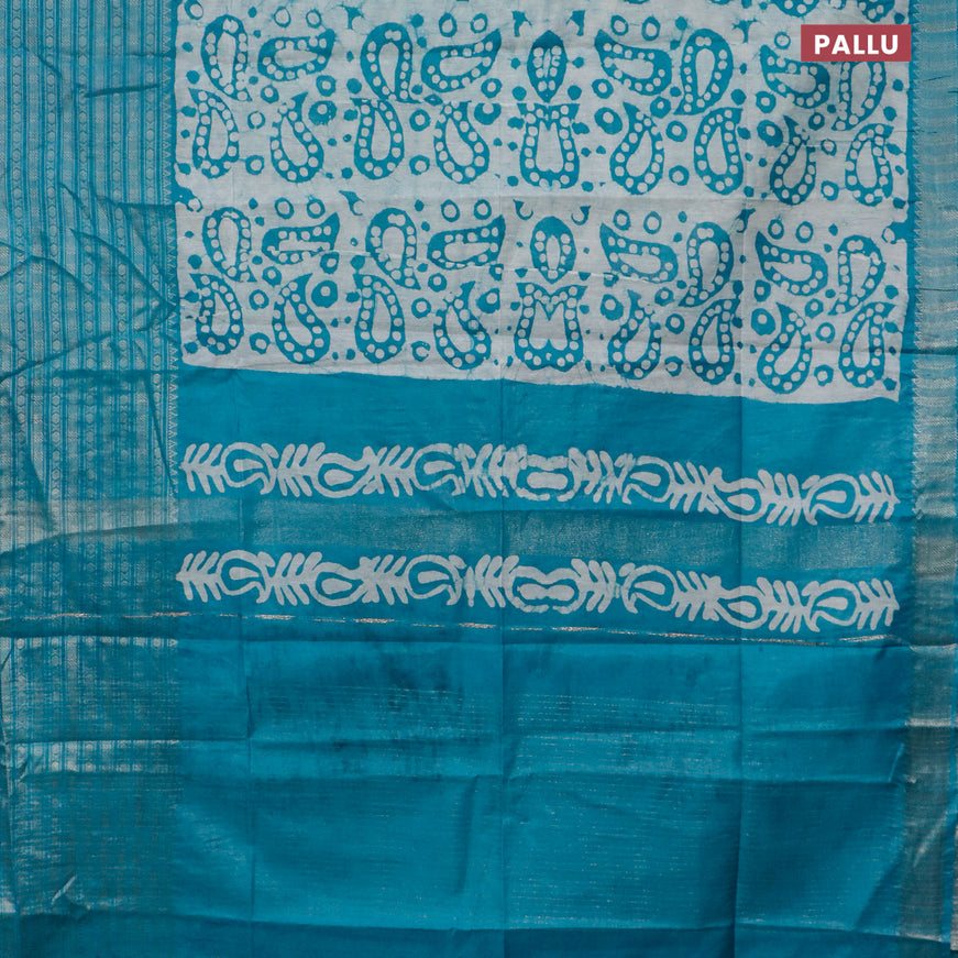 Semi tussar saree teal blue and beige with allover batik prints and long zari woven border