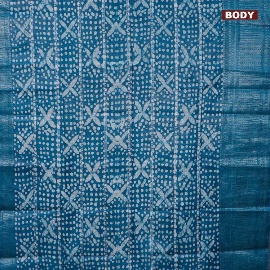 Semi tussar saree peacock blue with allover batik prints and long zari woven border