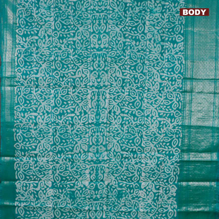 Semi tussar saree teal green and off white with allover batik prints and long zari woven border