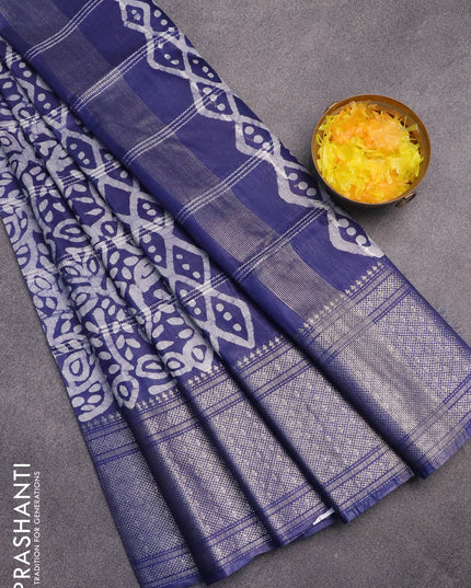 Semi tussar saree navy blue and off white with allover batik prints and long silver zari woven border