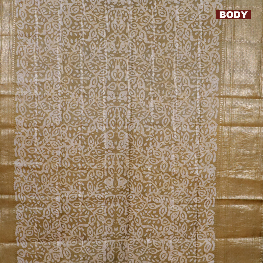 Semi tussar saree mehendi green and beige with allover batik prints and long zari woven border