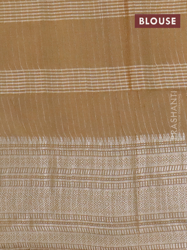 Semi tussar saree mehendi green and beige with allover batik prints and long silver zari woven border