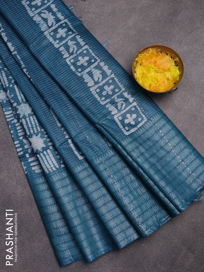 Semi tussar saree peacock blue and off white with allover batik prints and long silver zari woven border