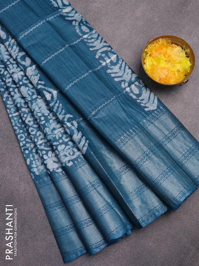 Semi tussar saree peacock blue with allover batik prints and long silver zari woven border