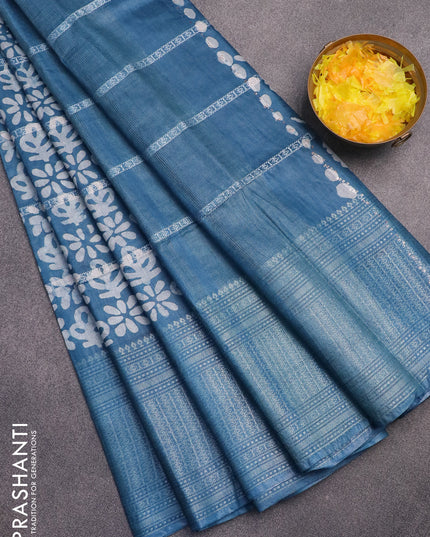 Semi tussar saree cs blue with allover batik prints and long silver zari woven border
