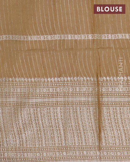 Semi tussar saree mehendi green with allover batik prints and long silver zari woven border