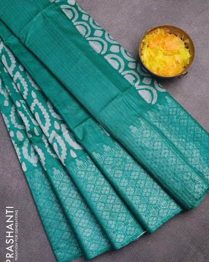 Semi tussar saree teal green and off white with allover batik prints and long silver zari woven border