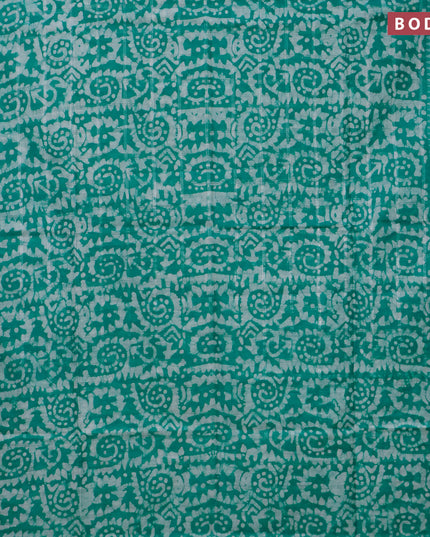 Semi tussar saree teal green and off white with allover batik prints and temple design silver zari woven border
