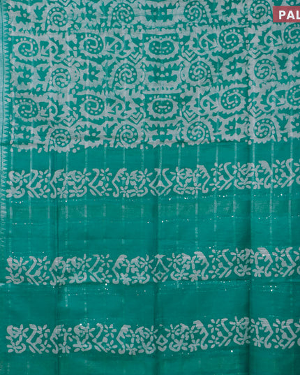 Semi tussar saree teal green and off white with allover batik prints and temple design silver zari woven border