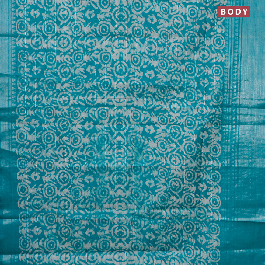 Semi tussar saree teal green and beige with allover batik prints and long silver zari woven border