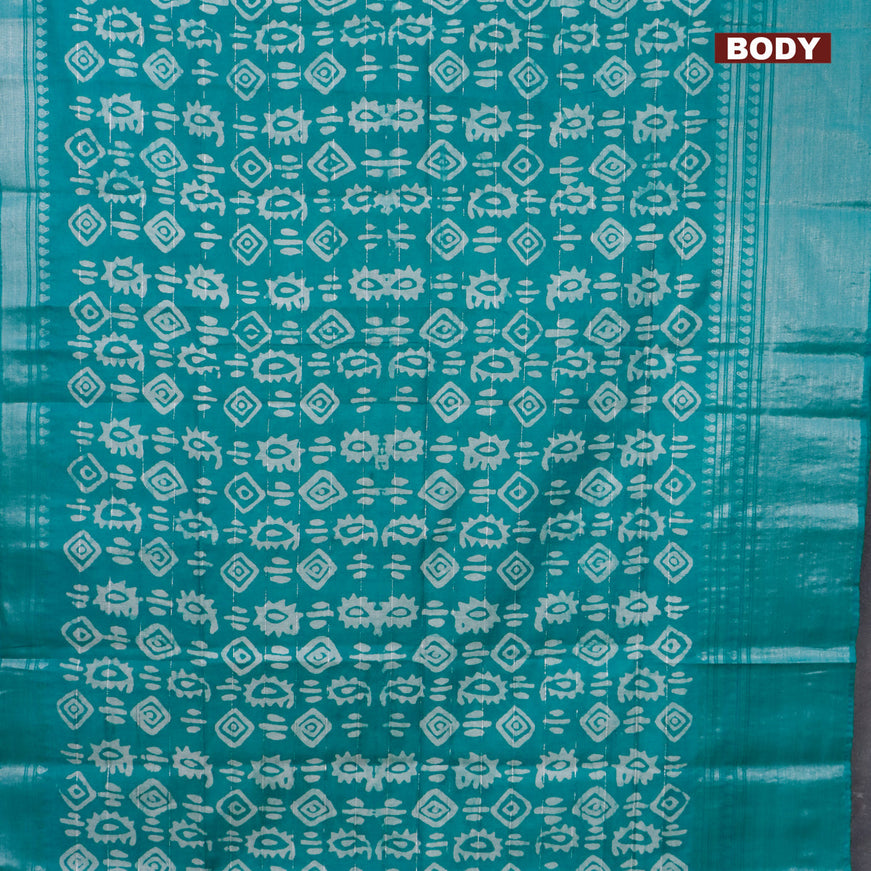 Semi tussar saree teal green with allover batik prints and long silver zari woven border
