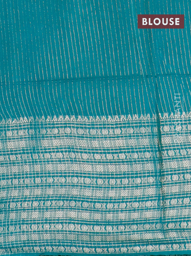 Semi tussar saree off white and teal green with allover batik prints and long zari woven border