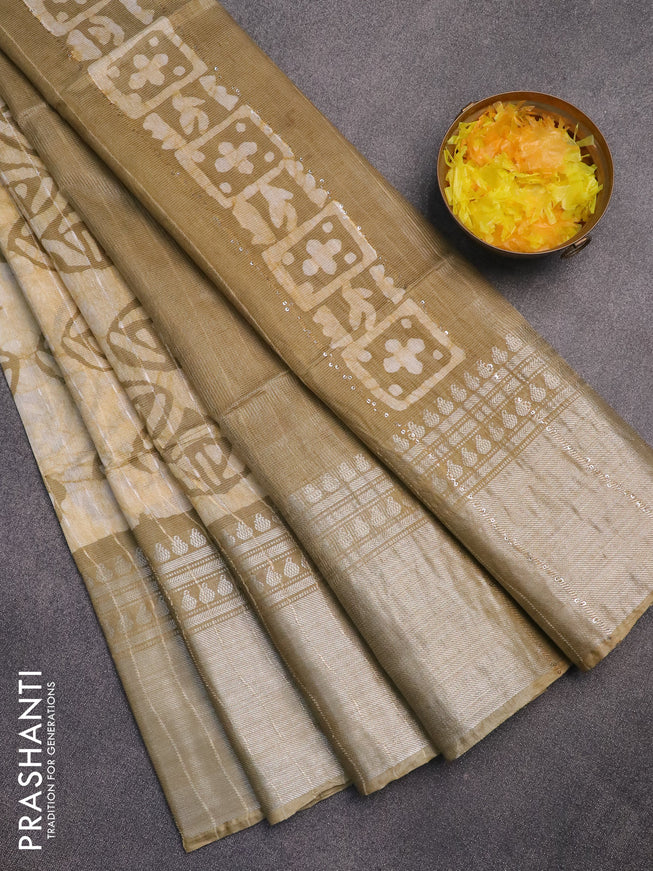 Semi tussar saree beige and elaichi green with allover batik prints and long zari woven border