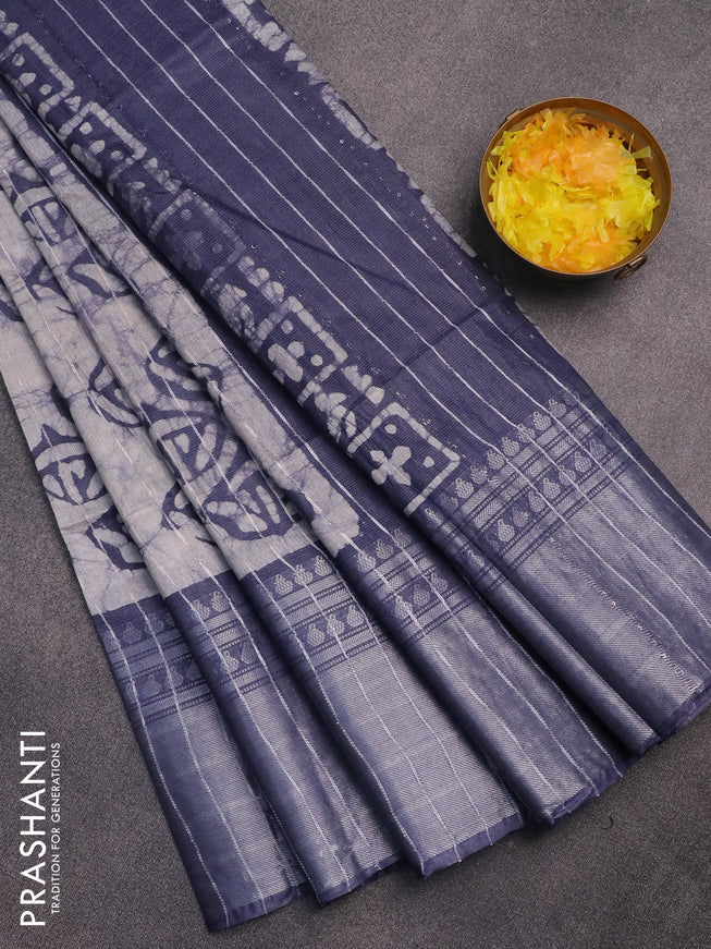 Semi tussar saree off white and dark grey with allover batik prints and long zari woven border