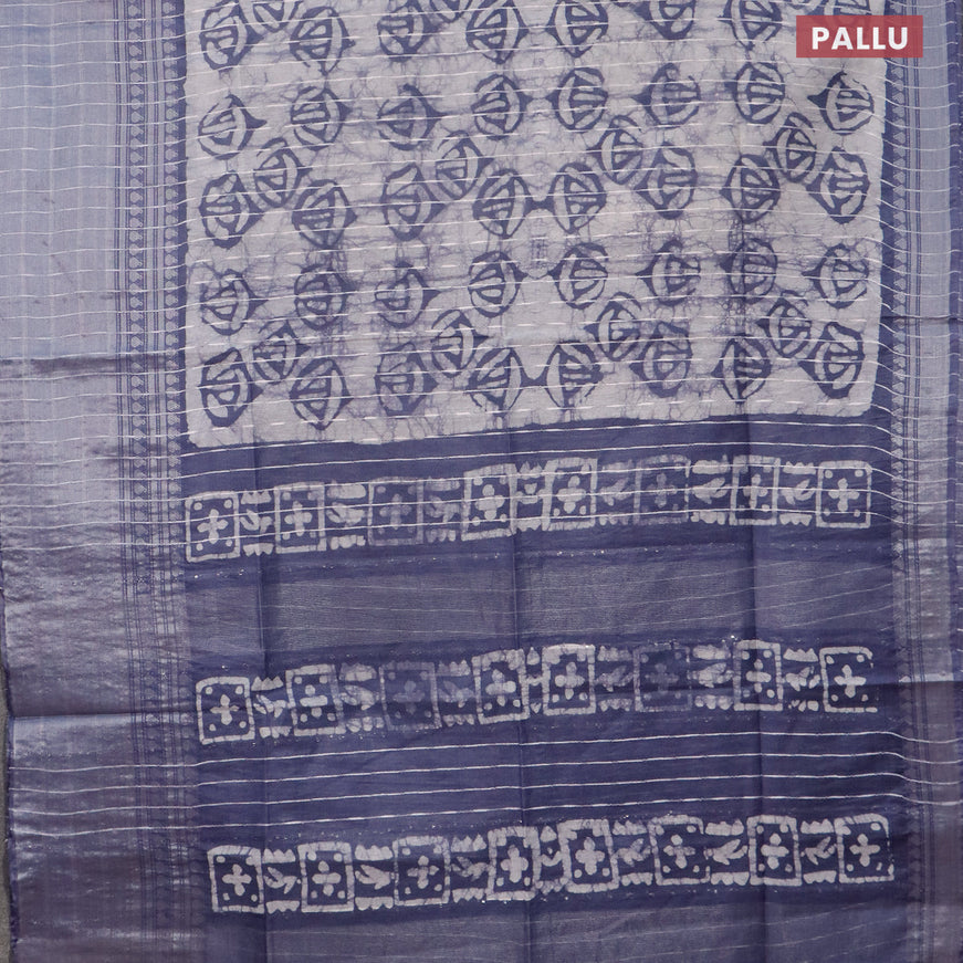 Semi tussar saree off white and dark grey with allover batik prints and long zari woven border