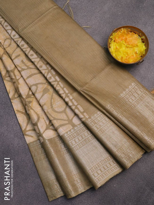 Semi tussar saree off white and pastel green with allover batik prints and long silver zari woven border