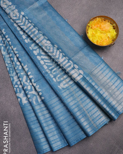 Semi tussar saree cs blue with allover batik prints & thread weaves and long silver zari woven border