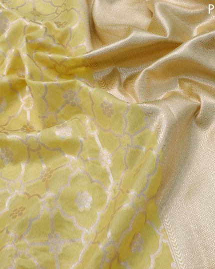 Banarasi cotton saree pale yellow with allover zari weaves and zari woven floral embroidery border