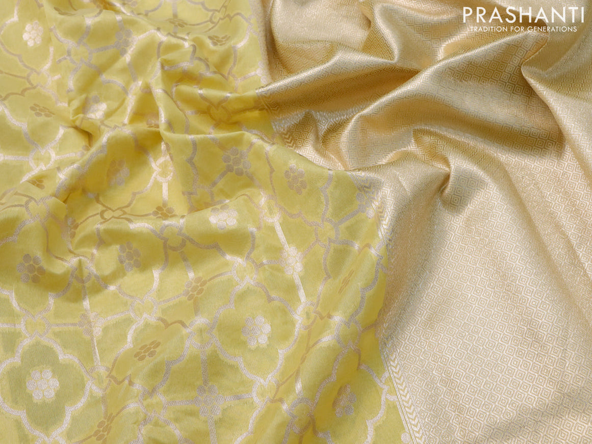 Banarasi cotton saree pale yellow with allover zari weaves and zari woven floral embroidery border