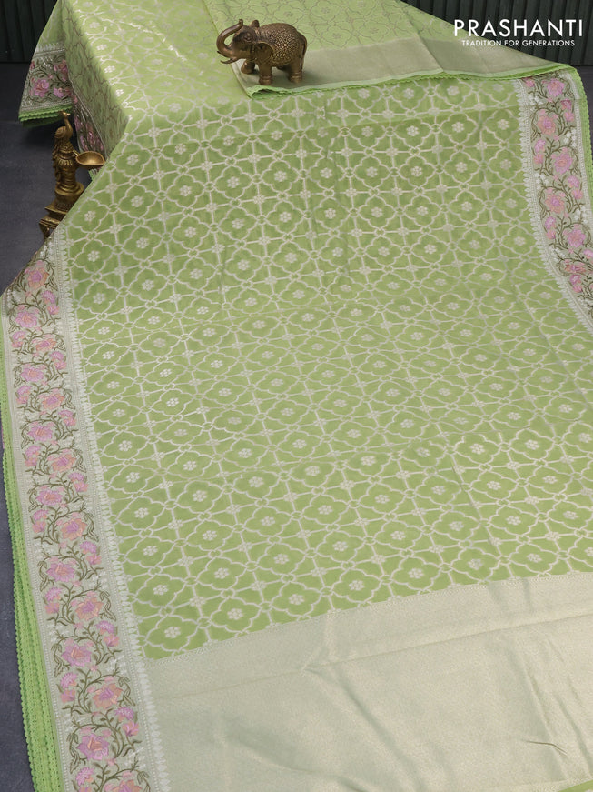 Banarasi cotton saree pista green with allover silver zari weaves and zari woven floral embroidery border