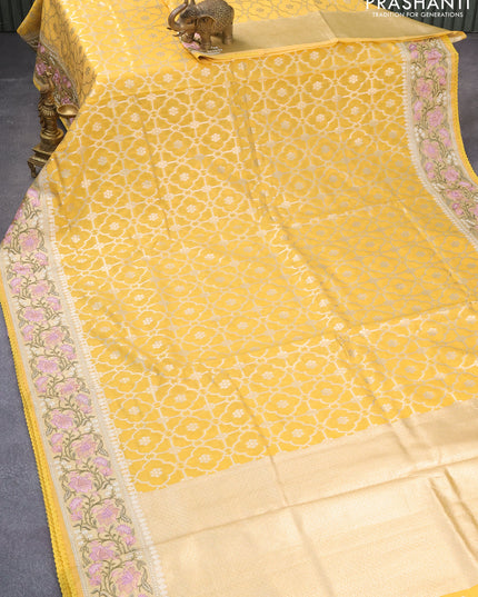 Banarasi cotton saree yellow with allover zari weaves and zari woven floral embroidery border