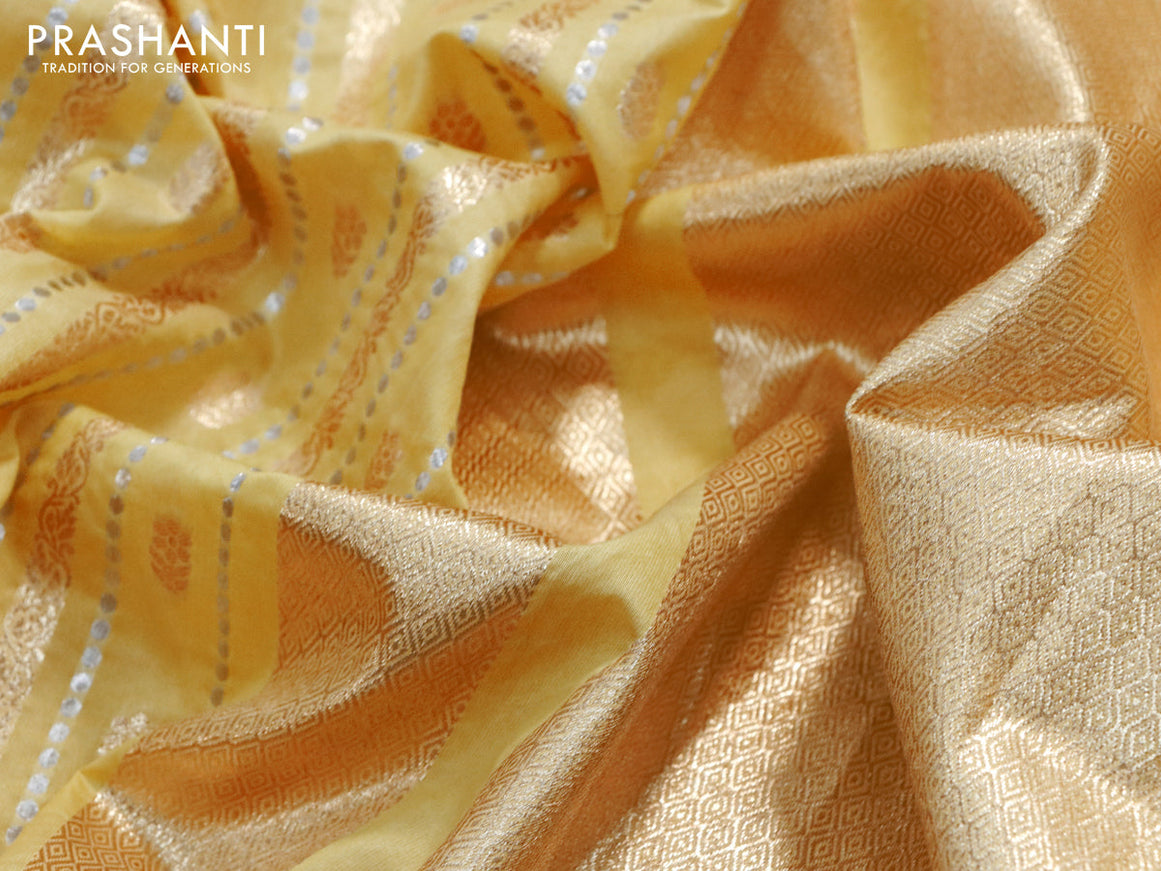 Banarasi cotton saree yellow with allover silver & gold zari weaves and floral embroidery border
