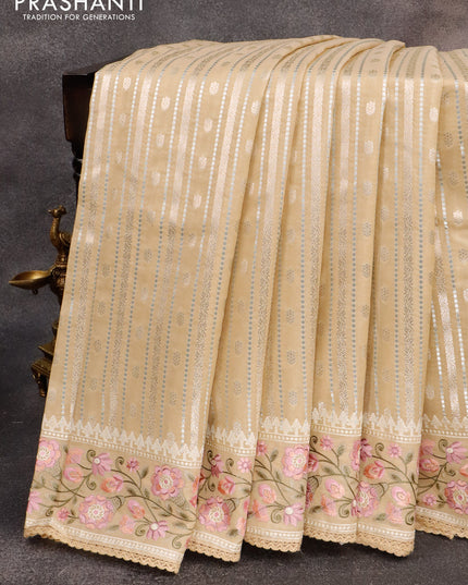 Banarasi cotton saree beige with allover silver & gold zari weaves and floral embroidery border