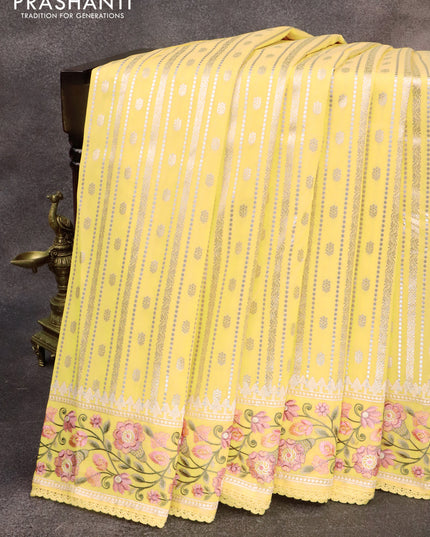 Banarasi cotton saree pale yelloew with allover silver & gold zari weaves and floral embroidery border