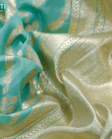 Banarasi cotton saree teal green with allover zari weaves and floral embroidery border