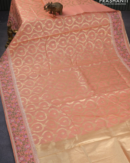 Banarasi cotton saree peach orange with allover zari weaves and floral embroidery border