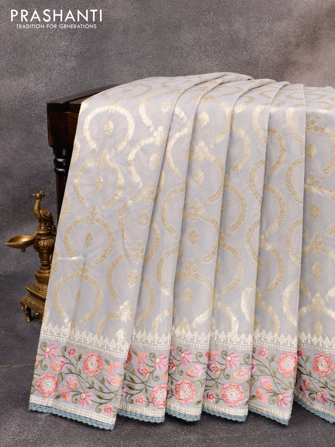 Banarasi cotton saree grey with allover zari weaves and floral embroidery border