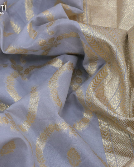 Banarasi cotton saree grey with allover zari weaves and floral embroidery border
